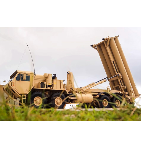 Truck with equipment lifted as if to fire a missile